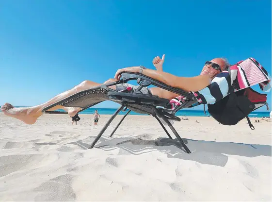  ?? Picture: RICHARD GOSLING ?? Kicking back at Surfers Paradise beach yesterday was chef Matt Vogel, who goes to the beach every day.
