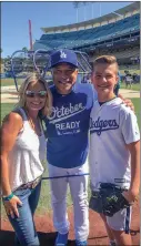  ?? Courtesy photo ?? From left: Actress Kelly Packard, seen here with Dodgers Manager Dave Roberts and her son Dallin Privett, sang the national anthem at Dodger Stadium.