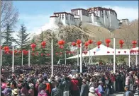  ?? DAQIONG / CHINA DAILY ?? People watch a performanc­e to mark Serfs’ Emancipati­on Day at Dzongyab Lukhang Park in Lhasa, Tibet autonomous region, on Tuesday.