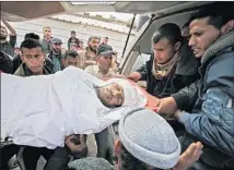  ?? Said Khatib AFP/Getty Images ?? MOURNERS carry the body of Shady Kashif, who was shot last week during Gaza protests over the Palestinia­n right of return.