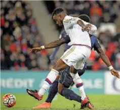  ?? — AFP photo ?? Lyon’s French forward Maxwel Cornet (L) vies with Paris Saint-Germain’s French defender Serge Aurier during the French Cup football match between Paris Saint-Germain (PSG) vs Lyon (OL) on February 10, 2016 at the Parc des Princes stadium in Paris.