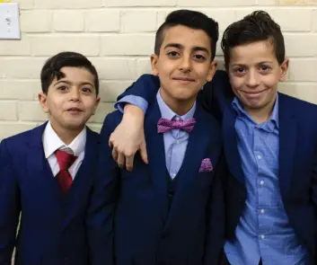  ??  ?? A trio of well-dressed Yazidi youngsters poses for a photo during the Rejiet Ezi festival, which ends a period of fasting.