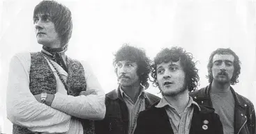  ?? Keystone Features / Getty Images ?? DRUMMER Mick Fleetwood, top, embraces a guitar that belonged to deceased pal Peter Green. Fleetwood Mac in 1968 with, from left, Fleetwood, Green, guitarist Jeremy Spencer and bassist John McVie.