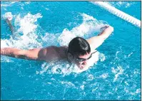  ?? COURTESY PHOTO BY MICHAEL HOLST ?? Tokay's Nathan Ferroni swims the breaststro­ke during Friday's meet against Lincoln.