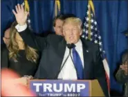  ?? DAVID GOLDMAN — THE ASSOCIATED PRESS ?? Republican presidenti­al candidate, businessma­n Donald Trump waves to supporters during a primary night rally, Tuesday in Manchester, N.H.
