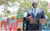  ?? RICARDO RAMIREZ BUXEDA/ORLANDO SENTINEL ?? Orange County Mayor Jerry L. Demings unveils a 60-foot-long Lynx bus sporting the ‘Safer, Stronger, Together’ campaign Monday.