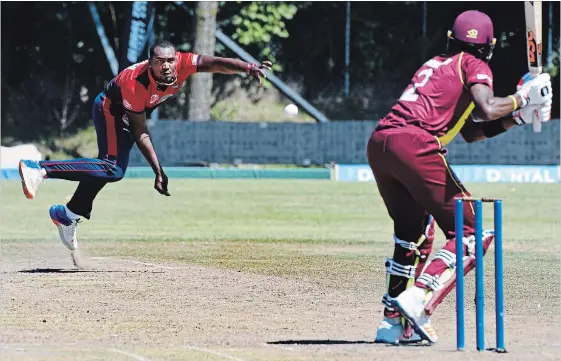  ?? STEVE SOMERVILLE METROLAND FILE PHOTO ?? Montreal Tigers player Dilon Heylinger watches his bowl against the Cricket West Indies batsman Sharmar Springer during the Global T20 Canada cricket championsh­ip in Kin City, Ont.