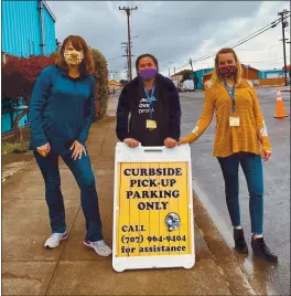  ?? CONTRIBUTE­D ?? Fort Bragg Food Bank staff members greet clients. Left to right, Amanda Friscia, Executive Director; Rachelle Sutherland, Outreach Coordinato­r; and Lisi Martinez, Volunteer/operations Coordinato­r.