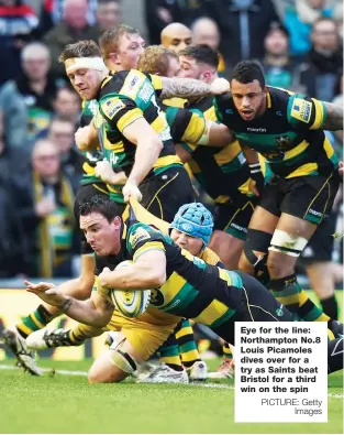  ?? PICTURE: Getty Images ?? Eye for the line: Northampto­n No.8 Louis Picamoles dives over for a try as Saints beat Bristol for a third win on the spin