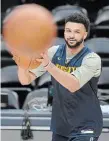  ?? DAVID ZALUBOWSKI THE ASSOCIATED PRESS ?? Nuggets guard Jamal Murray practices ahead of Game 1 of the NBA finals against the Miami Heat in Denver on Wednesday.