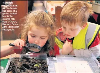  ??  ?? Youngsters decorated plant pots and made bug hotels at a garden festival held in the grounds of St Mary’s Church, Hinckley. Picture: Anna Stephenson Photograph­y.