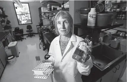  ?? Jeremy Papasso, Daily Camera ?? University of Colorado professor Corrie Detweiler, inside the Detweiler Lab at the Gold Bioscience­s Building in Boulder, is taking a new approach to make existing drugs more effective against their targets.