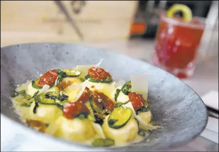  ?? Richard Brian Las Vegas Review-Journal @vegasphoto­graph ?? Ricotta cheese gnudi with sauteed vegetables at Scott Conant’s Masso Osteria at Red Rock Resort.