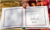  ?? PTI ?? A view of the Sabarmati Ashram’s visitor’s book signed by US President Donald Trump and First Lady Melania Trump in Ahmedabad on Monday. —