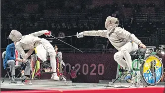  ?? AP ?? China's Li Hao (L) in action against Ukraine's Artem Manko in the Fencing men's sabre category A final at the Tokyo Paralympic­s.