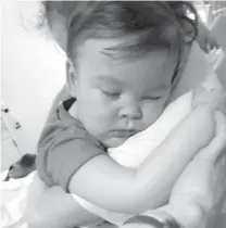  ?? ASSOCIATED PRESS ?? In this April 23, 2018 handout photo provided by Alfies Army Official, brain-damaged toddler Alfie Evans cuddles by his mother Kate James at Alder Hey Hospital, Liverpool, England.