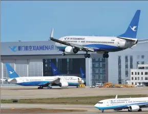  ?? PROVIDED TO CHINA DAILY ?? Xiamen Airlines’ passenger airplanes are seen at Fuzhou Changle Internatio­nal Airport in Fuzhou, Fujian province, on March 21.