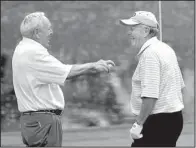  ?? AP/ROB CARR ?? Arnold Palmer (left) and Jack Nicklaus joke with one another at a par-3 warm-up tournament during the 2010 Masters in Augusta, Ga. Palmer, who won 62 titles on the PGA Tour and was the first golfer to earn $1 million in purses, died Sunday at the age...