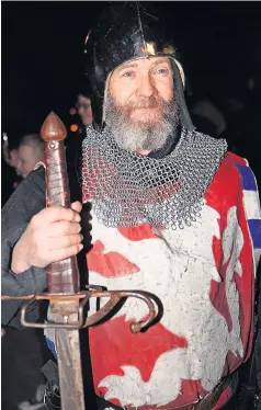  ?? ?? Back in time Medieval soldier at the Old Stirling Bridge lights switch-on