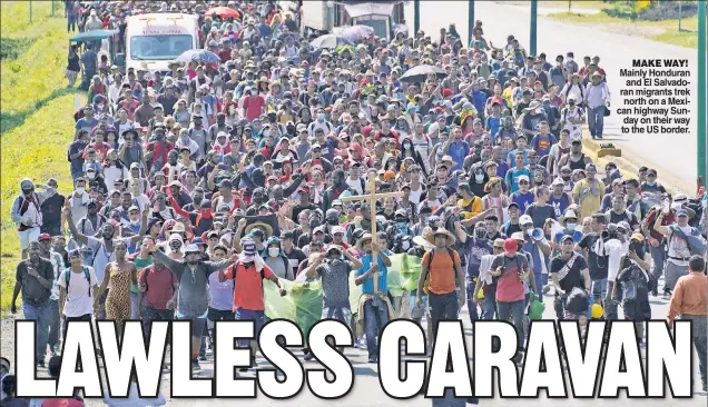  ?? ?? MAKE WAY! Mainly Honduran and El Salvadoran migrants trek north on a Mexican highway Sunday on their way to the US border.