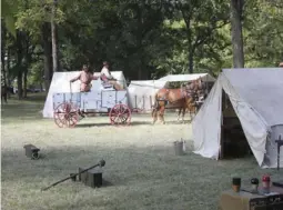  ?? ?? Teamsters drive through camp at the Fort Towson Historic Site.