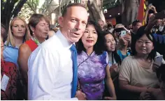  ?? EPA ?? Australian Prime Minister Tony Abbott speaks to people during a visit to Chinatown in Sydney, Australia, yesterday.