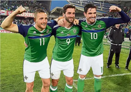  ??  ?? triple threat: Northern Ireland’s (from left) Conor Washington, Will Gregg and Kyle Lafferty – who scored the three goals in the 3-0 friendly win over Belarus – celebrate after the match in Belfast. — AFP