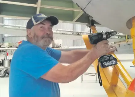  ??  ?? LABOUR OF LOVE: Nhill engineer Mick Kingwill works on a restored Avro Anson aircraft at Nhill Aviation Heritage Centre. Kingwill has had a primary role in rebuilding the historic aircraft donated by Graham Drage of Lah.