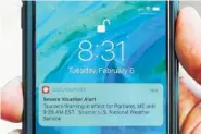  ?? THE ASSOCIATED PRESS ?? Jeremy DaRos shows the erroneous tsunami alert he received on his phone Feb. 6 in Portland, Maine.