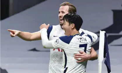  ??  ?? Tottenham’s Son Heung-min (right), who scored his side’s first goal, celebrates with Harry Kane, who scored the second, during the victory against Arsenal. Photograph: Glyn Kirk/AP