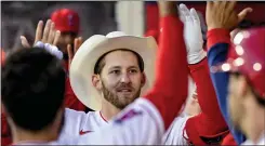  ?? LEONARD ORTIZ – STAFF PHOTOGRAPH­ER ?? The Angels’ Taylor Ward is congratula­ted after hitting a grand slam against the Guardians on April 27at Angel Stadium. He hit another slam May 14at Oakland.