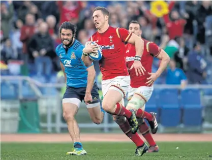  ??  ?? Wales’ George North runs in a try during their Six Nations match against Italy recently.