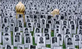  ?? ?? Pictures of people killed by Serb forces in the Bosnian city of Prijedor displayed as part of a 2019 ‘white ribbon’ commemorat­ion in Sarajevo. Photograph: Anadolu Agency/Getty Images