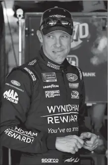  ?? COLIN E. BRALEY/AP PHOTO ?? Driver Matt Kenseth stands in the garage area before a practice run on Friday at Kansas Speedway in Kansas City, Kan.