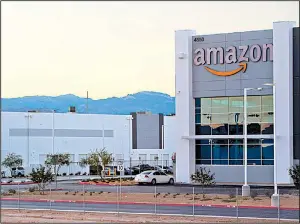  ?? AP ?? An Amazon fulfillmen­t center in Las Vegas is part of the e-commerce giant’s sprawling empire.