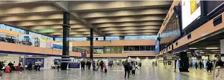  ??  ?? Above: An almost deserted concourse at London Euston at 18.45 on the evening of Monday, June 29, is an indicator of how few passengers are travelling.