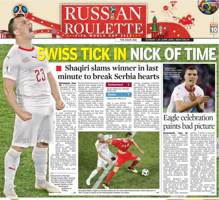  ?? — AP AP ?? Nemanja Matic ( right) of Serbia tussles for the ball with Switzerlan­d’s Valon Behrami in their Group E match at the Kaliningra­d Stadium on Friday. — Switzerlan­d’s Xherdan Shaqiri exults after scoring his side’s second goal during their Group E match...