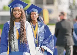  ?? Armin Caratao/Spring Independen­t School District ?? Cali Johnson and A’myri Phillips, the first African American female valedictor­ian and salutatori­an, graduated from Dekaney High School in Spring. The TEA says high school students in Texas are doing better on STAAR tests.