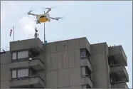  ?? Stefan Wermuth / Bloomberg ?? An M2 delivery drone, manufactur­ed by Matternet, carries a box containing laboratory samples in Bern, Switzerlan­d.