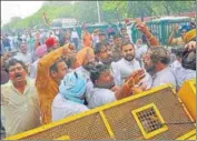  ?? RAVI KUMAR/HT ?? Punjab Congress president Amarinder Singh Raja Warring and other party workers facing water cannons during a protest in Chandigarh on Thursday.