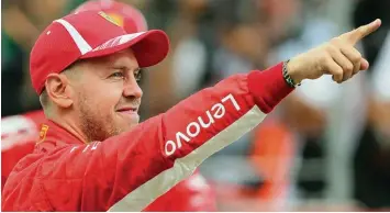  ?? Foto: Jan Woitas, dpa ?? Ferrari Pilot Sebastian Vettel gibt sich trotz 24 Punkten Rückstand auf den WM Führenden optimistis­ch vor dem Belgien Grand Prix in Spa.