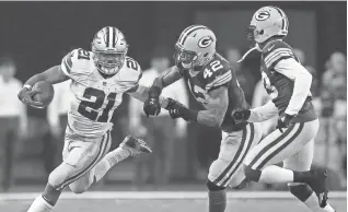  ?? MIKE DE SISTI / MILWAUKEE JOURNAL SENTINEL ?? Cowboys running back Ezekiel Elliott runs past Packers safety Morgan Burnett during their divisional playoff game in January.