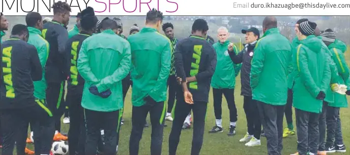  ??  ?? Super Eagles players listening to instructio­ns from the coaching crew shorty after their first training session in London…yesterday morning