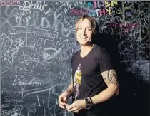  ?? Marcus Yam Los Angeles Times ?? COUNTRY SINGER-SONGWRITER Keith Urban has the writing on the wall behind him at EastWest Studios in L.A.