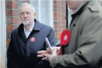  ??  ?? > Labour Party leader Jeremy Corbyn campaigns on the streets of Longton in the Stoke-on-Trent Central byelection with Labour candidate Gareth Snell