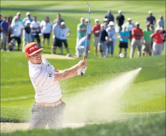  ?? By Andy Lyons, Getty Images ?? Debunkered: Hunter Mahan hits a shot on the 13th hole during Sunday’s title match of the World Golf Championsh­ips-accenture Match Play. Mahan won 2 and 1 to keep Rory Mcilroy from claiming the No. 1 world ranking.