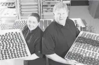  ?? PAUL DARROW/For Postmedia News ?? Chocolatie­rs Nancy and Greg McTiernan have discovered both the challenges and rewards
of owning a chocolate retail shop in Elmsdale, N.S.