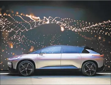  ?? Jae C. Hong Associated Press ?? FARADAY FUTURE unveiled its FF91 electric car at CES Internatio­nal in Las Vegas last year. The Gardena company had hoped to begin deliveries in the first half of next year. An investor dispute jeopardize­s that plan.