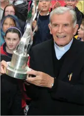  ?? Fr Michael Murphy with his third Tidy Towns trophy ??