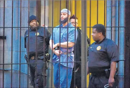  ?? Karl Merton Ferron Baltimore Sun ?? ADNAN SYED is escorted from court in Baltimore after the first day of his 2016 hearing for a retrial. He’s been behind bars for 19 years.